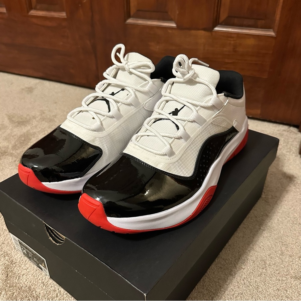 Never Worn Men’s Air Jordan 11 CMFT Low in White/Black-University Red